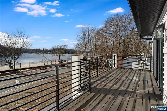 a view of outdoor space with wooden floor and city view