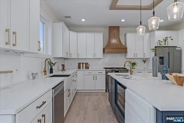 a kitchen with cabinets appliances and a counter top space