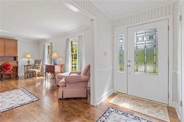 a view of a dining room with furniture window and wooden floor