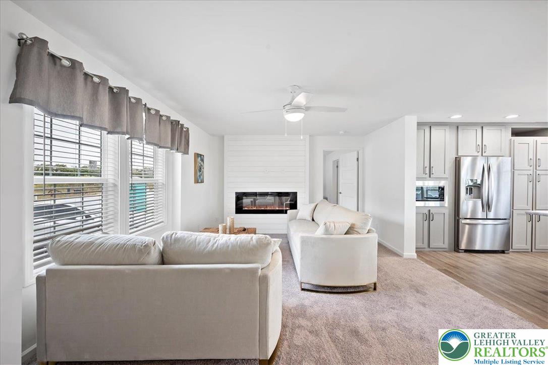 3983 Hastings Road Walnutport, PA 18088 - Photo 13 of 39 a living room with furniture and a flat screen tv