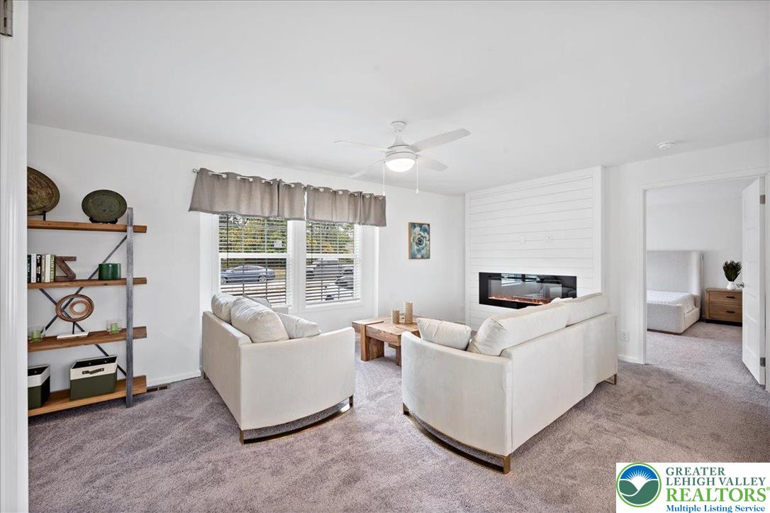 3983 Hastings Road Walnutport, PA 18088 - Photo 14 of 39 a living room with furniture and a flat screen tv