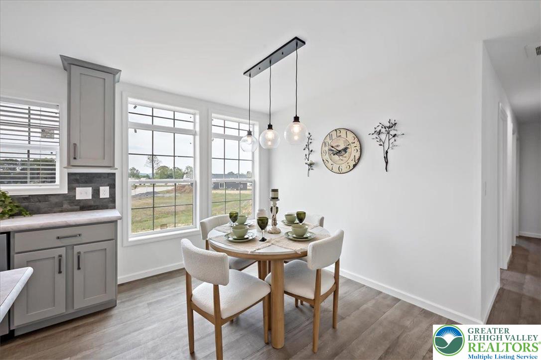 3983 Hastings Road Walnutport, PA 18088 - Photo 21 of 39 a view of a dining room with furniture window and wooden floor