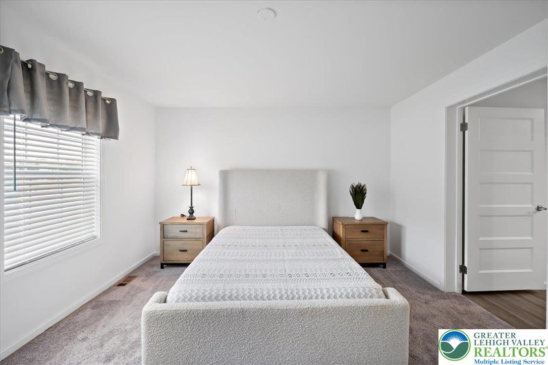 3983 Hastings Road Walnutport, PA 18088 - Photo 23 of 39 a bed sitting in a bedroom next to a window