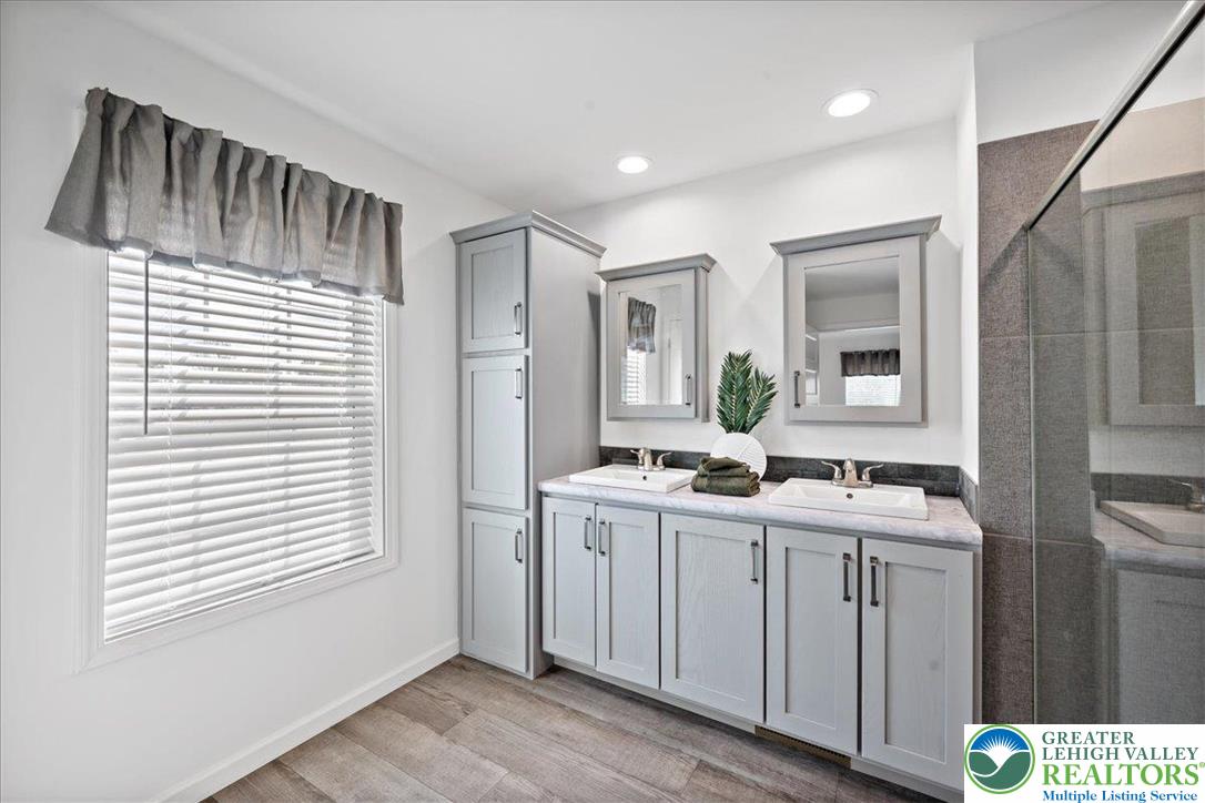 3983 Hastings Road Walnutport, PA 18088 - Photo 27 of 39 a bathroom with a sink a vanity and a mirror