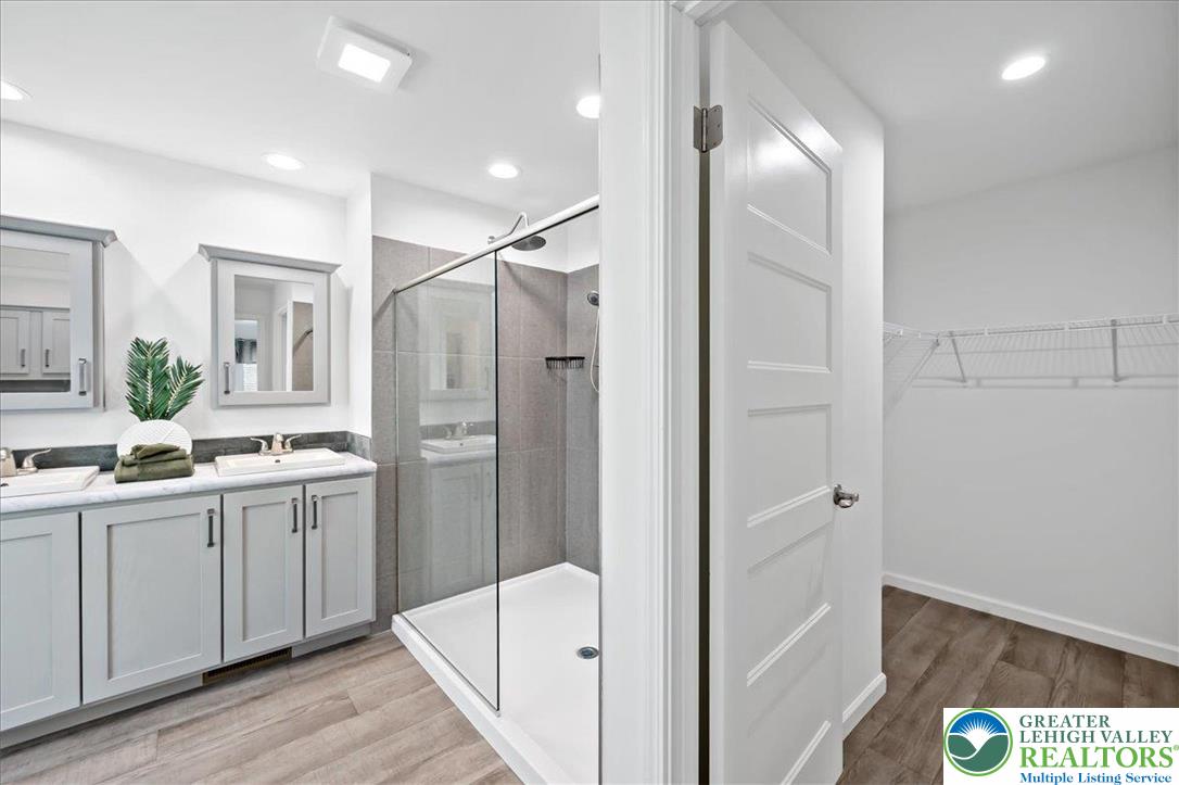 3983 Hastings Road Walnutport, PA 18088 - Photo 29 of 39 a bathroom with a double vanity sink mirror and shower