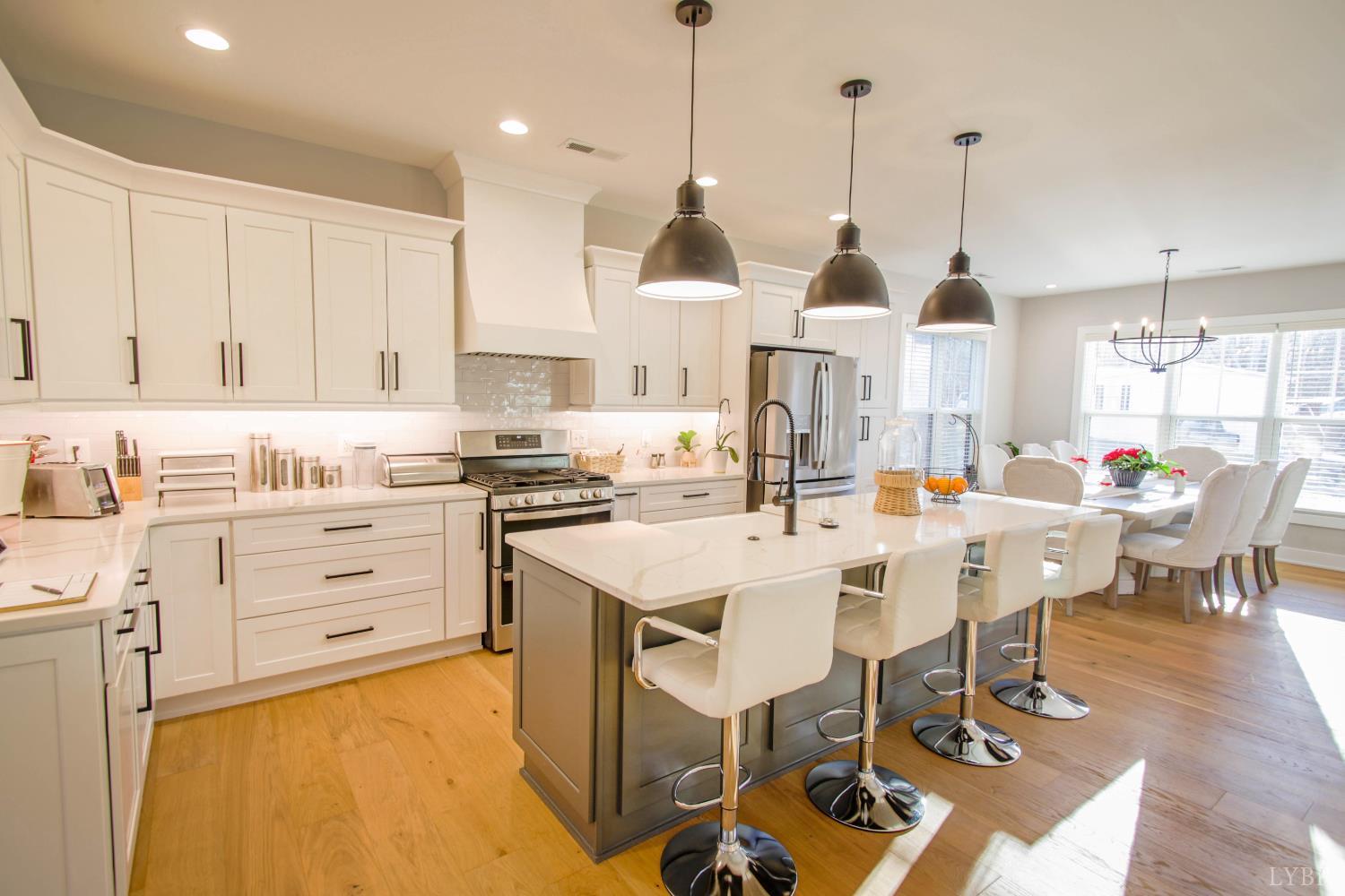 133 Bentley Grv Way Lynchburg, VA 24502 - Photo 20 of 48 a kitchen with white cabinets appliances and chairs
