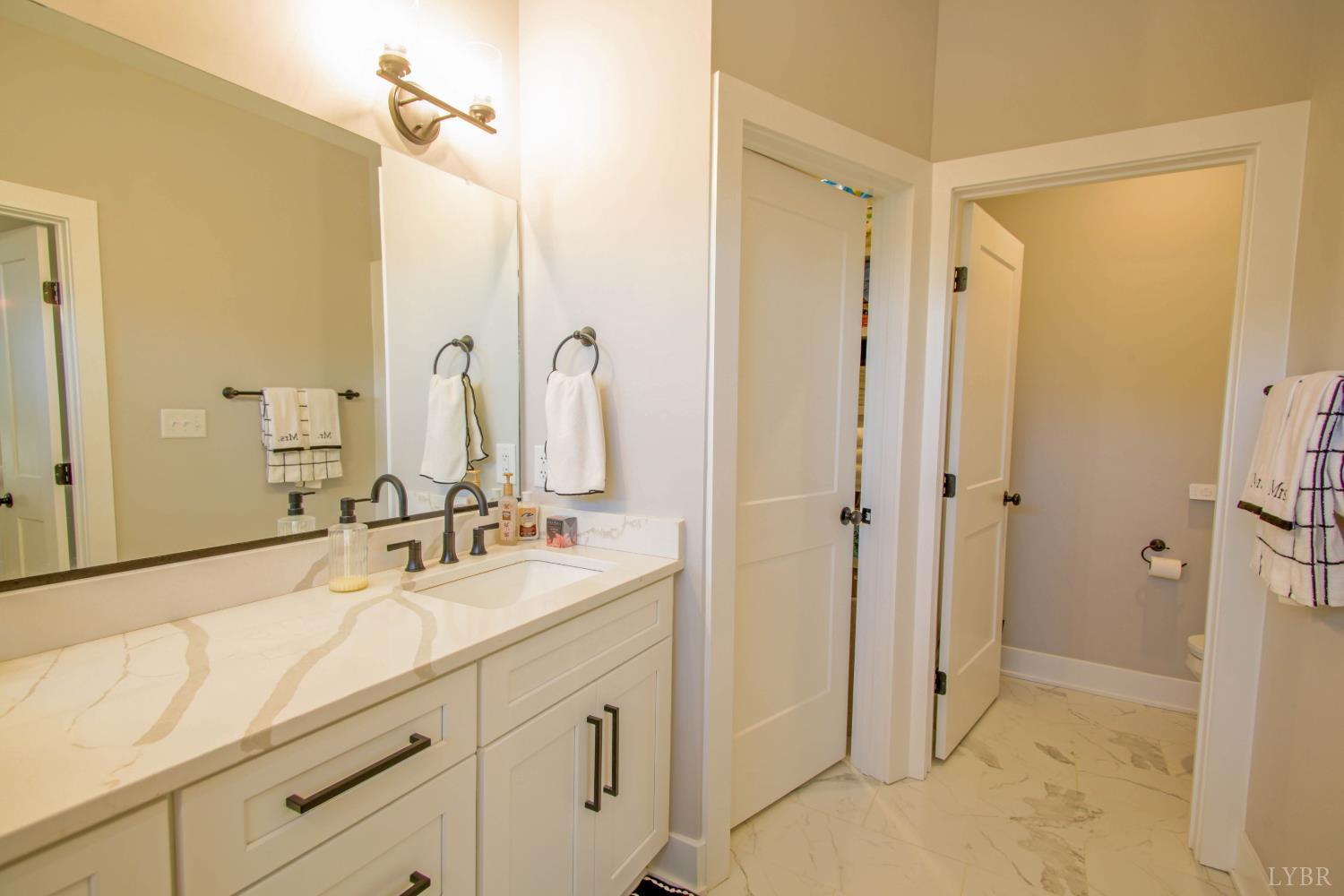 133 Bentley Grv Way Lynchburg, VA 24502 - Photo 31 of 48 a bathroom with a double vanity sink mirror and shower