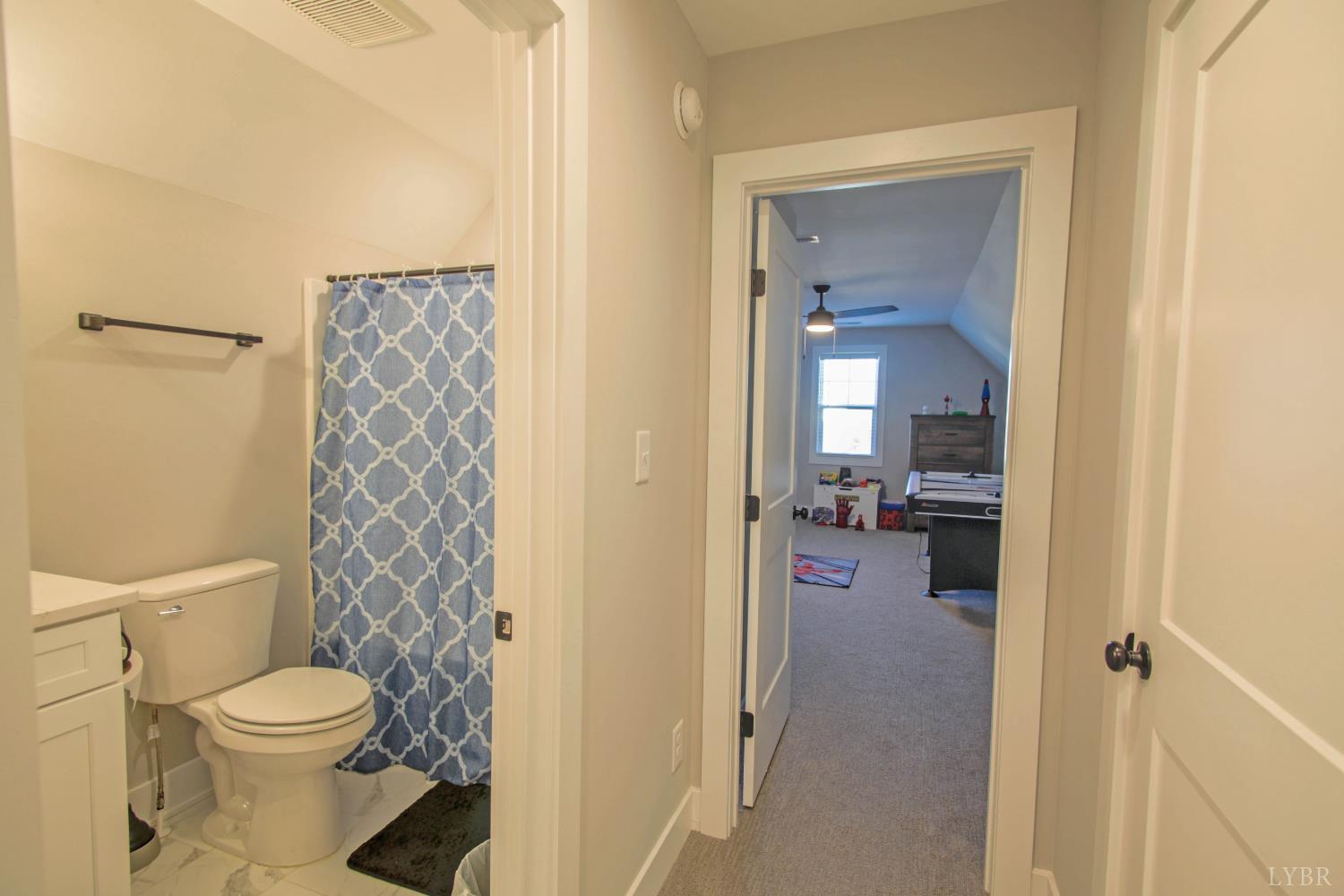 133 Bentley Grv Way Lynchburg, VA 24502 - Photo 38 of 48 a bathroom with a granite countertop toilet a sink and a mirror