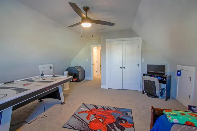 a bedroom with furniture and a wooden floor