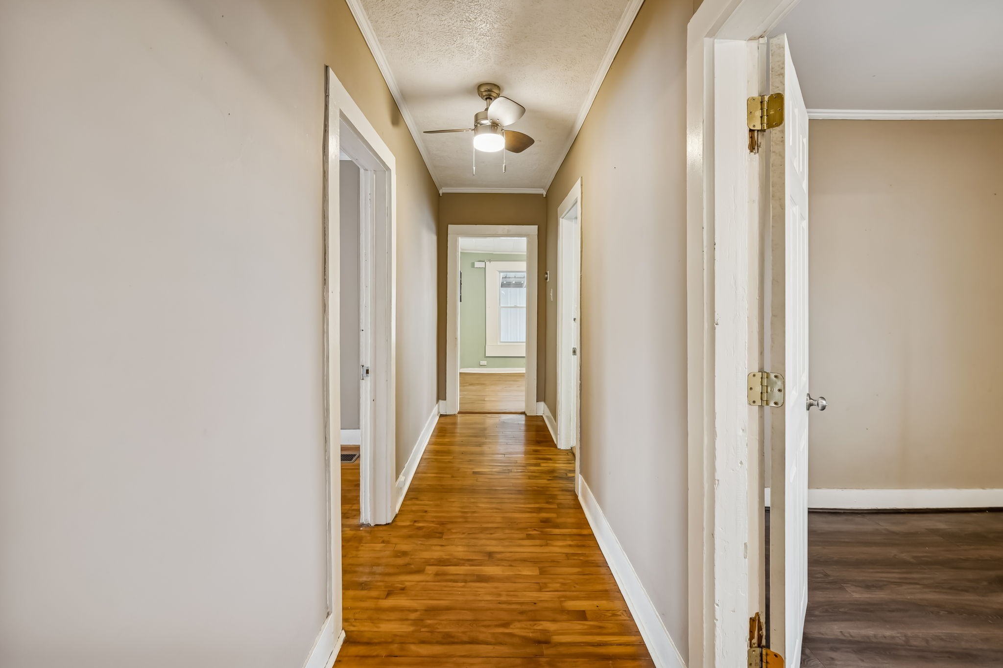 203 Hull Avenue Carthage, TN 37030 - Photo 7 of 27 a view of a hallway with wooden floor and a bathroom