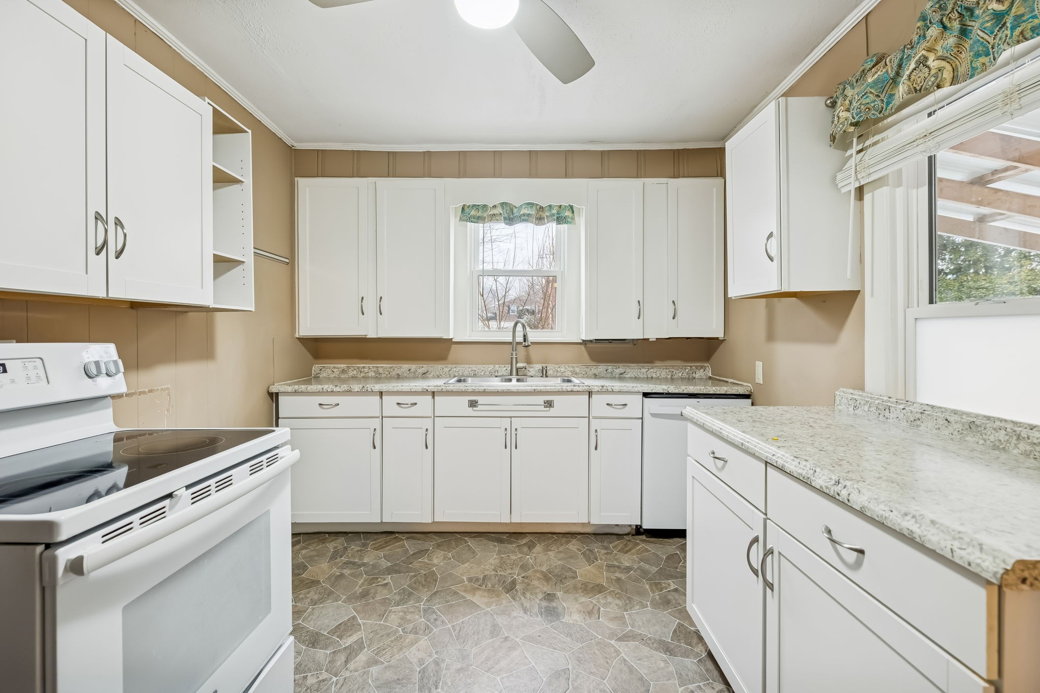 203 Hull Avenue Carthage, TN 37030 - Photo 8 of 27 a kitchen with granite countertop white cabinets sink and appliances