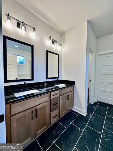 a kitchen with stainless steel appliances a sink stove and cabinets