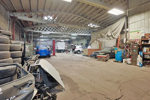 a view of parking garage with cars