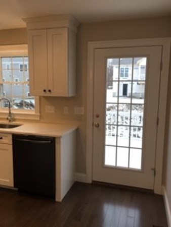 67 Fieldstone Lane, Unit 2 Fall River, MA 02720 - Photo 5 of 6 a kitchen with stainless steel appliances granite countertop a sink dishwasher a stove and a refrigerator with wooden floor