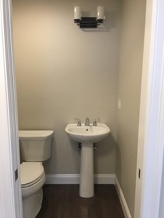 67 Fieldstone Lane, Unit 2 Fall River, MA 02720 - Photo 6 of 6 a white toilet sitting next to a white sink