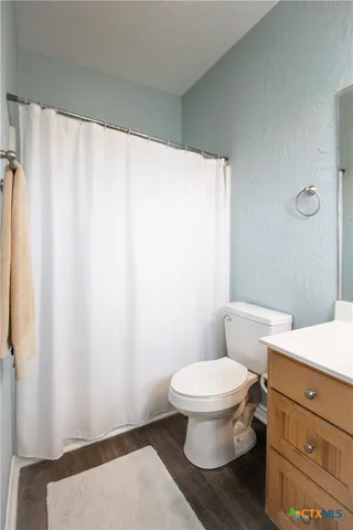 a view of a room with wooden walls