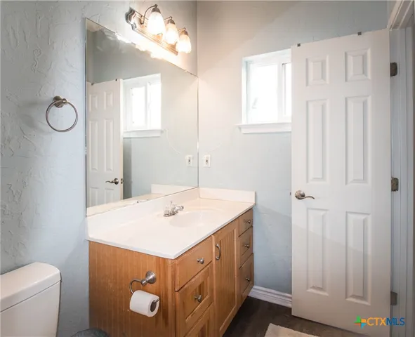 a living room with furniture and a rug