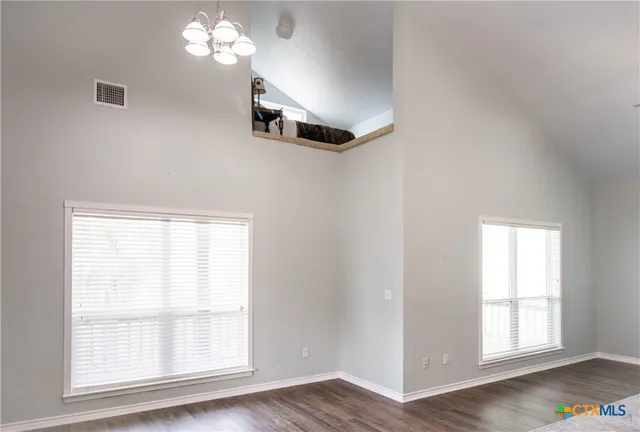 a living room with furniture and a piano