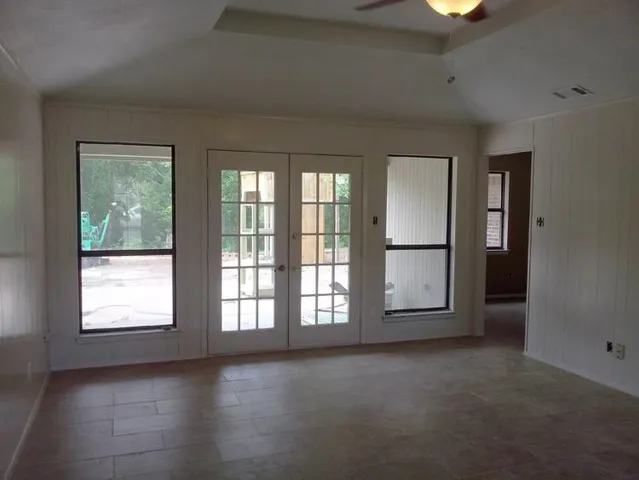 an empty room with windows