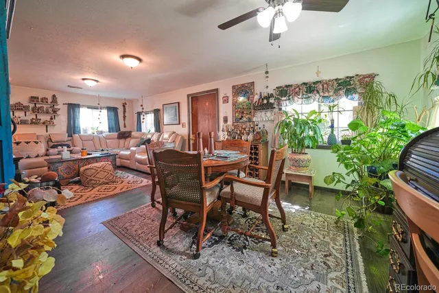 a view of a dining room with furniture and chandelier