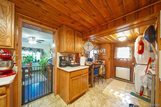 a view of a kitchen with furniture and a kitchen