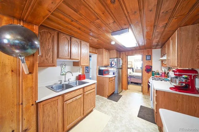 a bedroom with a bed and dresser with mirror
