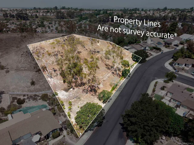an aerial view of mountain with yard
