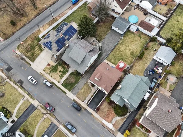 an aerial view of a house with a mountain view