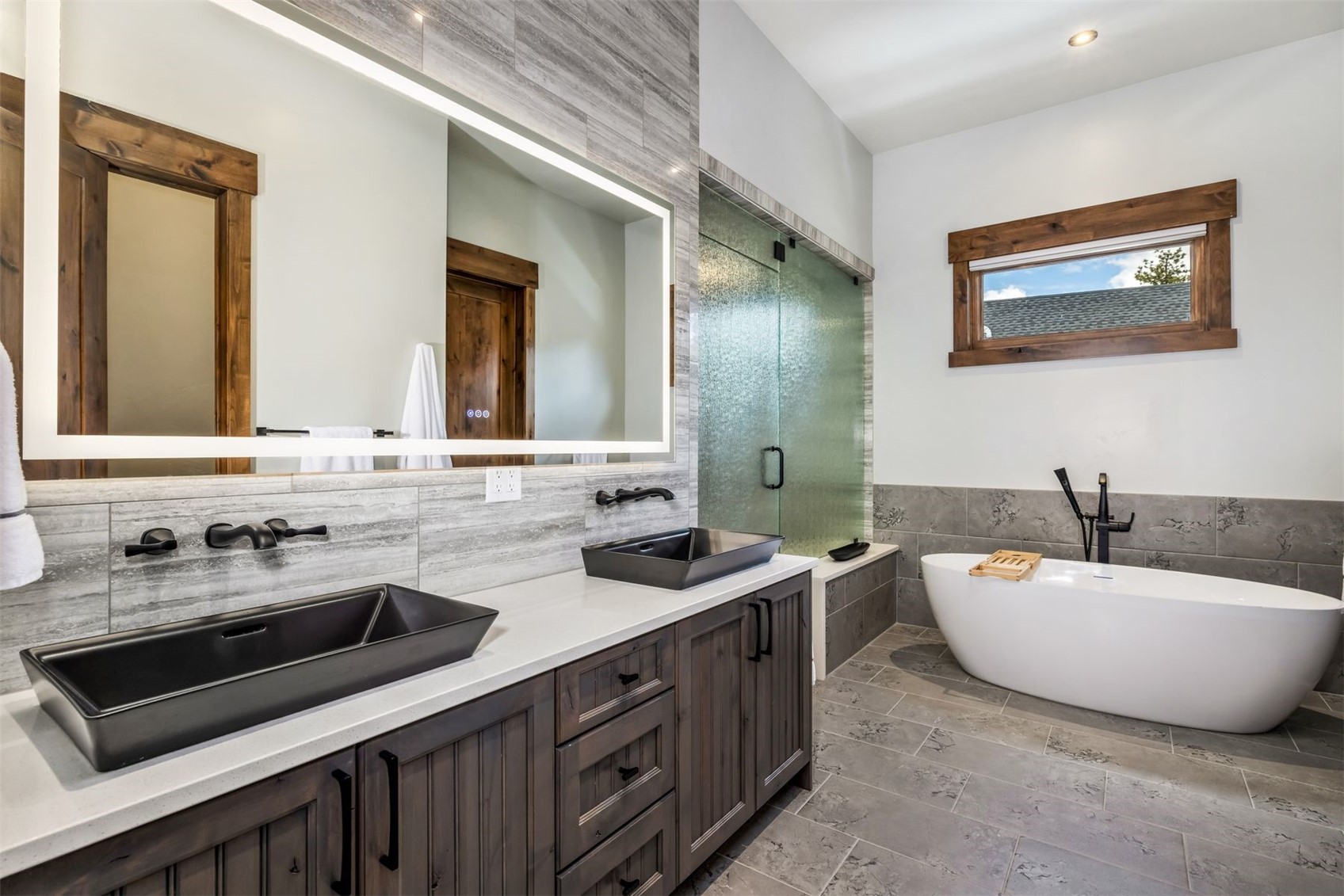 99 Independence Lane Keystone, CO 80435 - Photo 18 of 50 a spacious bathroom with a double vanity sink a mirror and a bathtub
