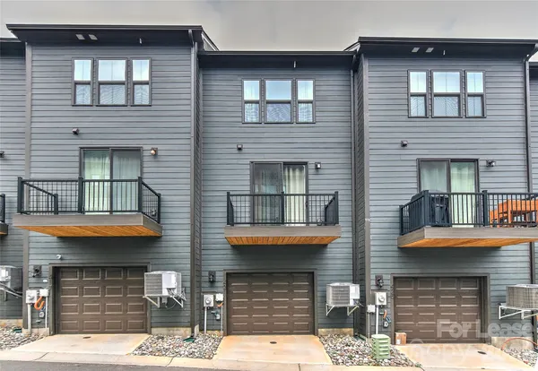 a front view of a house with a garage
