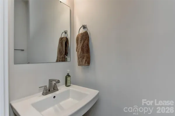 a bathroom with a sink and mirror