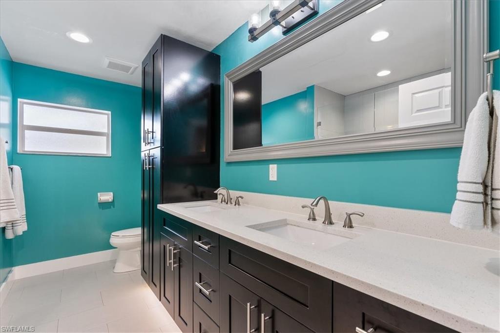 1820 19th Street Southwest Naples, FL 34117 - Photo 1 of 31 a bathroom with a sink and a mirror