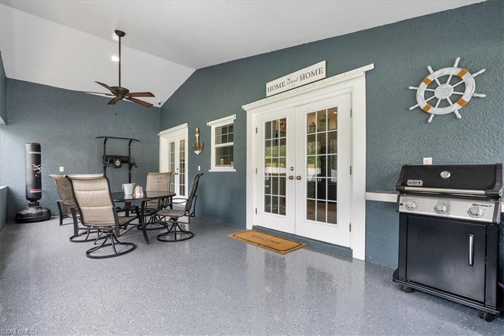 1820 19th Street Southwest Naples, FL 34117 - Photo 19 of 31 a view of a livingroom with furniture and a chandelier
