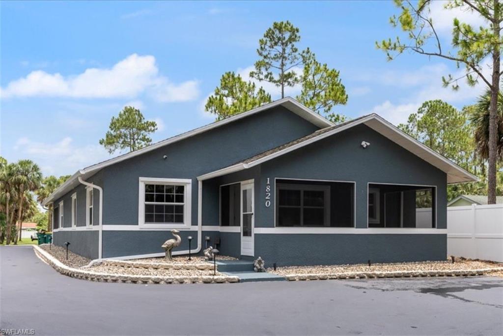 1820 19th Street Southwest Naples, FL 34117 - Photo 21 of 31 a house with trees in the background