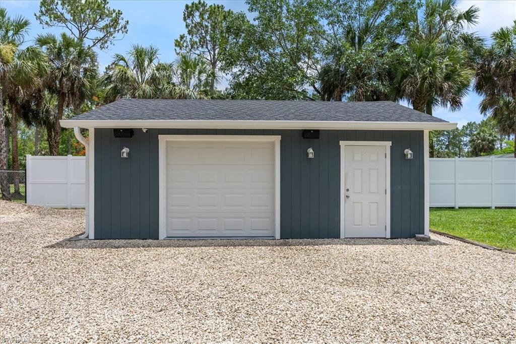 1820 19th Street Southwest Naples, FL 34117 - Photo 25 of 31 a front view of a house with a yard