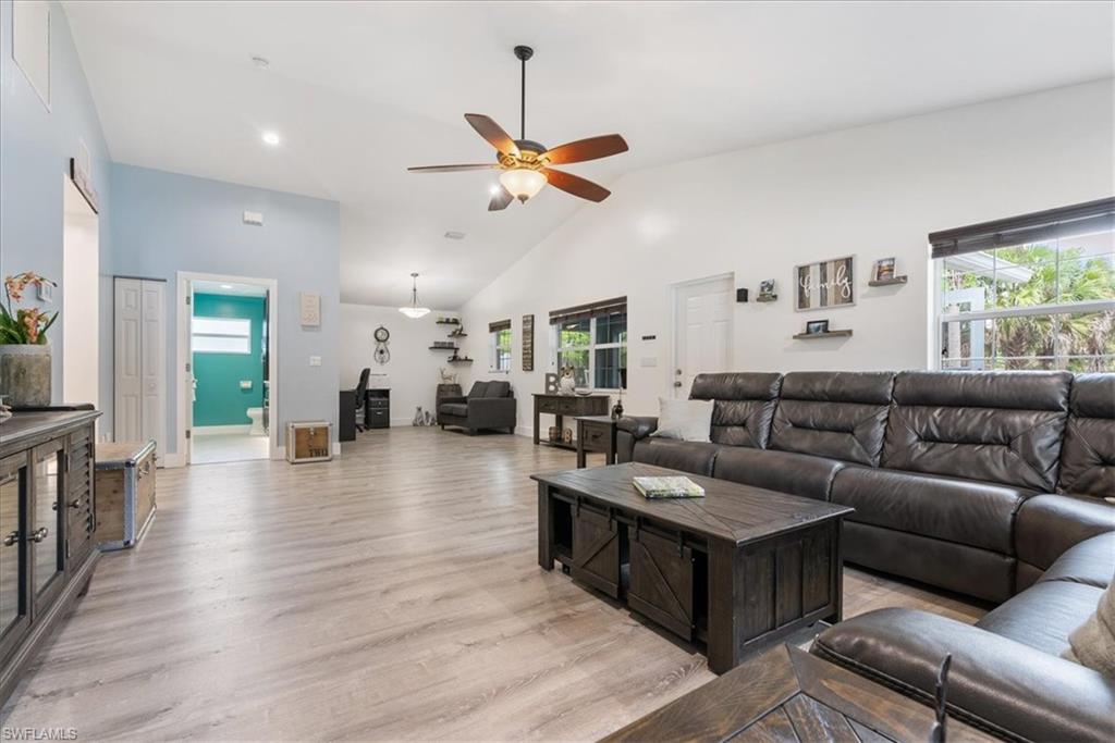 1820 19th Street Southwest Naples, FL 34117 - Photo 3 of 31 a living room with furniture and wooden floor