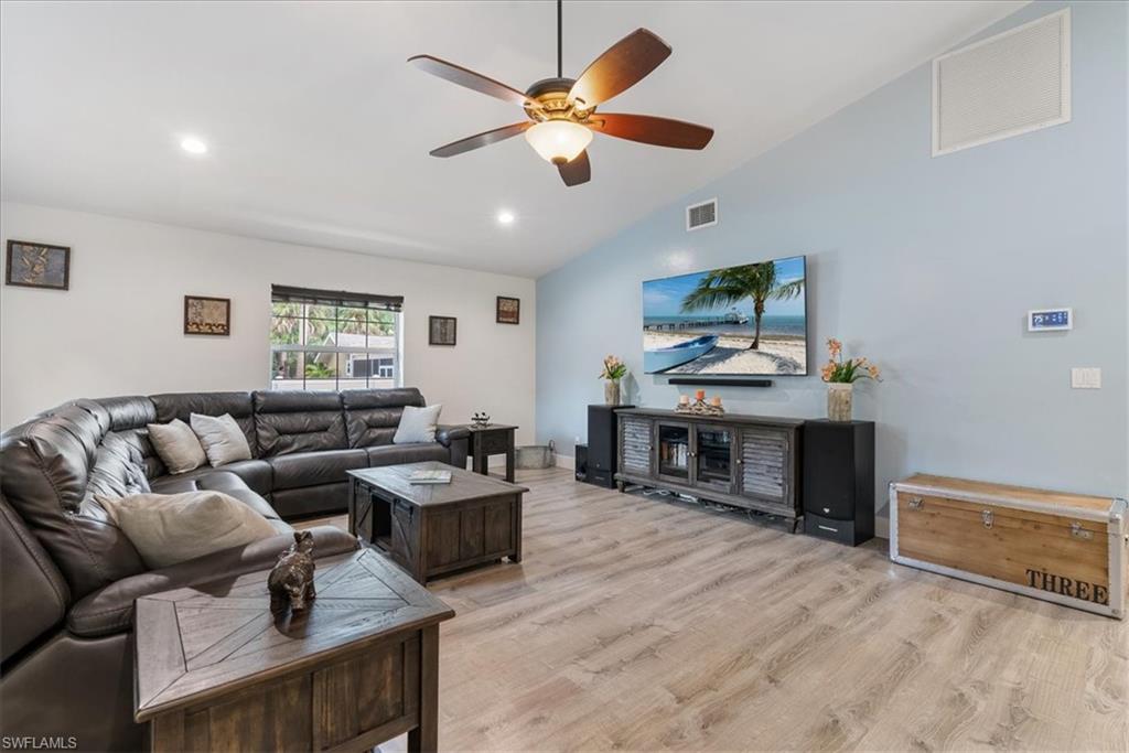 1820 19th Street Southwest Naples, FL 34117 - Photo 5 of 31 a living room with furniture and a flat screen tv