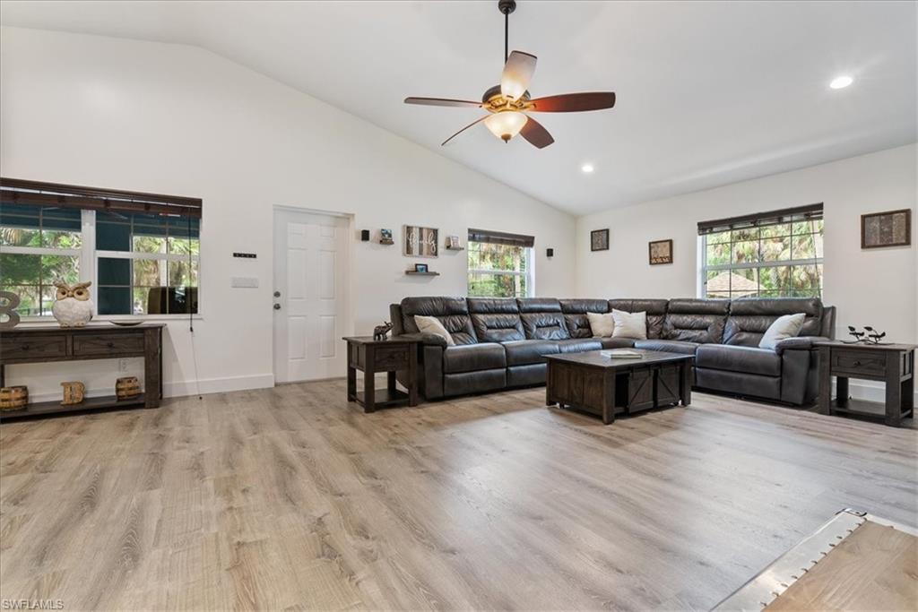 1820 19th Street Southwest Naples, FL 34117 - Photo 6 of 31 a living room with furniture and a flat screen tv