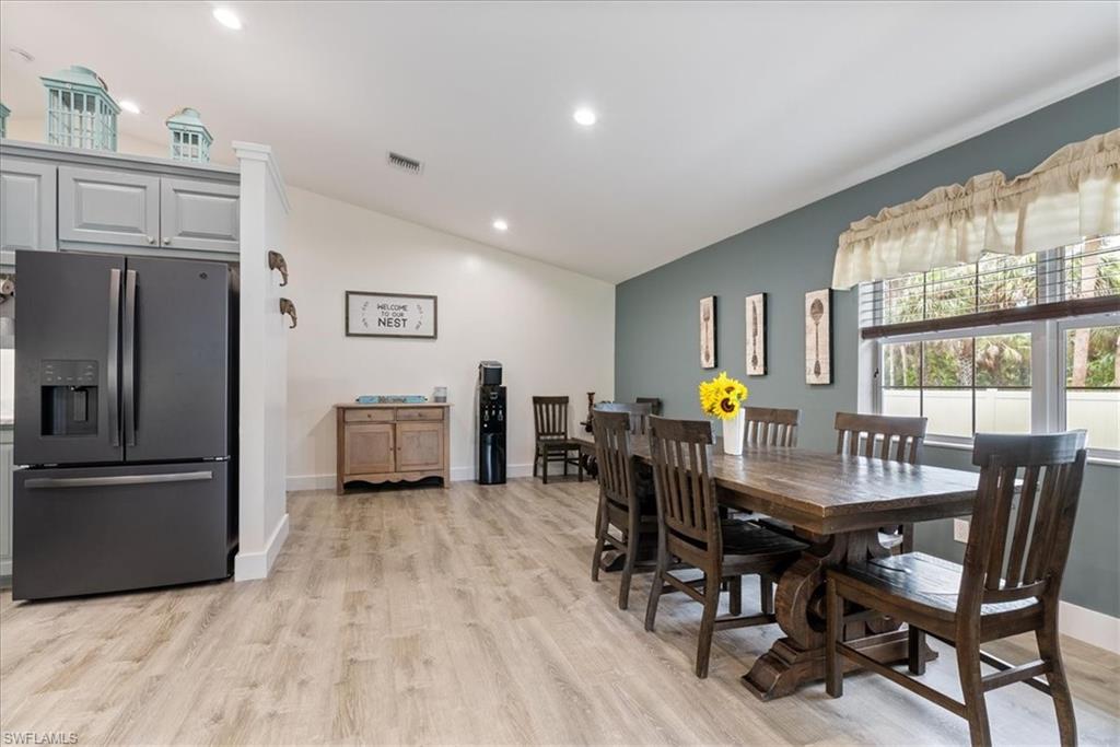 1820 19th Street Southwest Naples, FL 34117 - Photo 10 of 31 a view of a dining room with furniture window and wooden floor