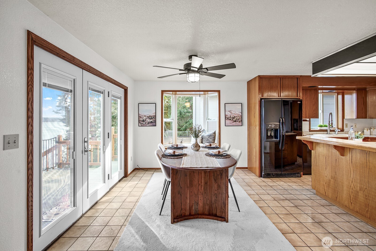 6819 Clf Avenue Southwest Longbranch, WA 98351 - Photo 12 of 29 a living room with stainless steel appliances granite countertop furniture a fireplace and a large window