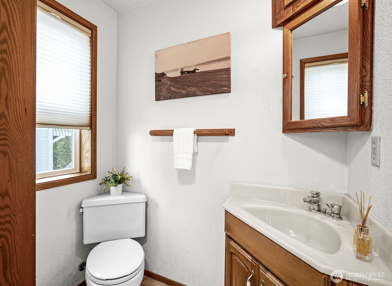 6819 Clf Avenue Southwest Longbranch, WA 98351 - Photo 15 of 29 a bathroom with a toilet sink and mirror