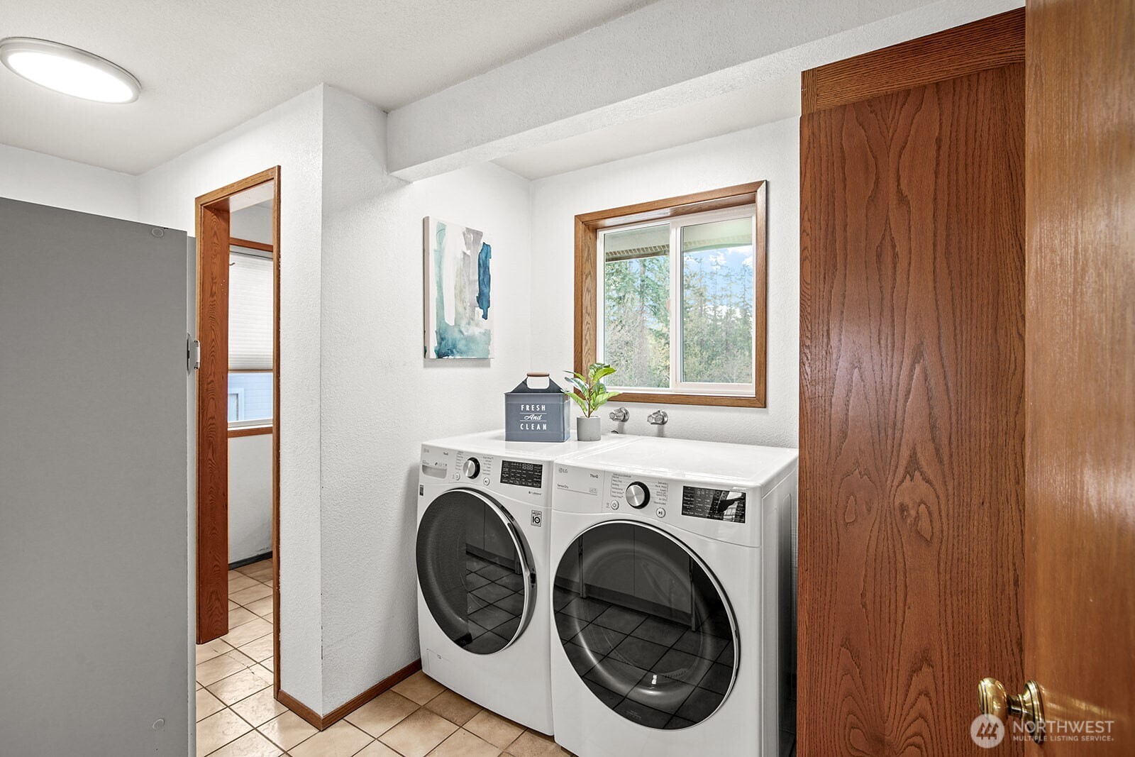 6819 Clf Avenue Southwest Longbranch, WA 98351 - Photo 16 of 29 a view of a hallway with washer and dryer