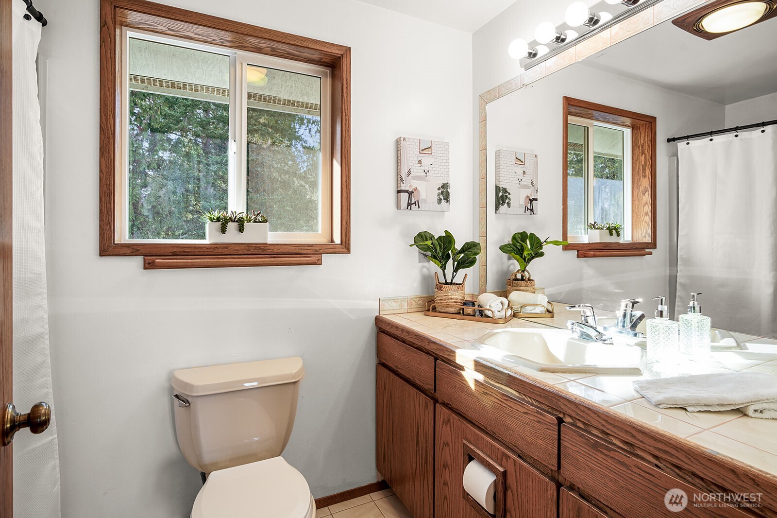 6819 Clf Avenue Southwest Longbranch, WA 98351 - Photo 18 of 29 a bathroom with a toilet sink and mirror
