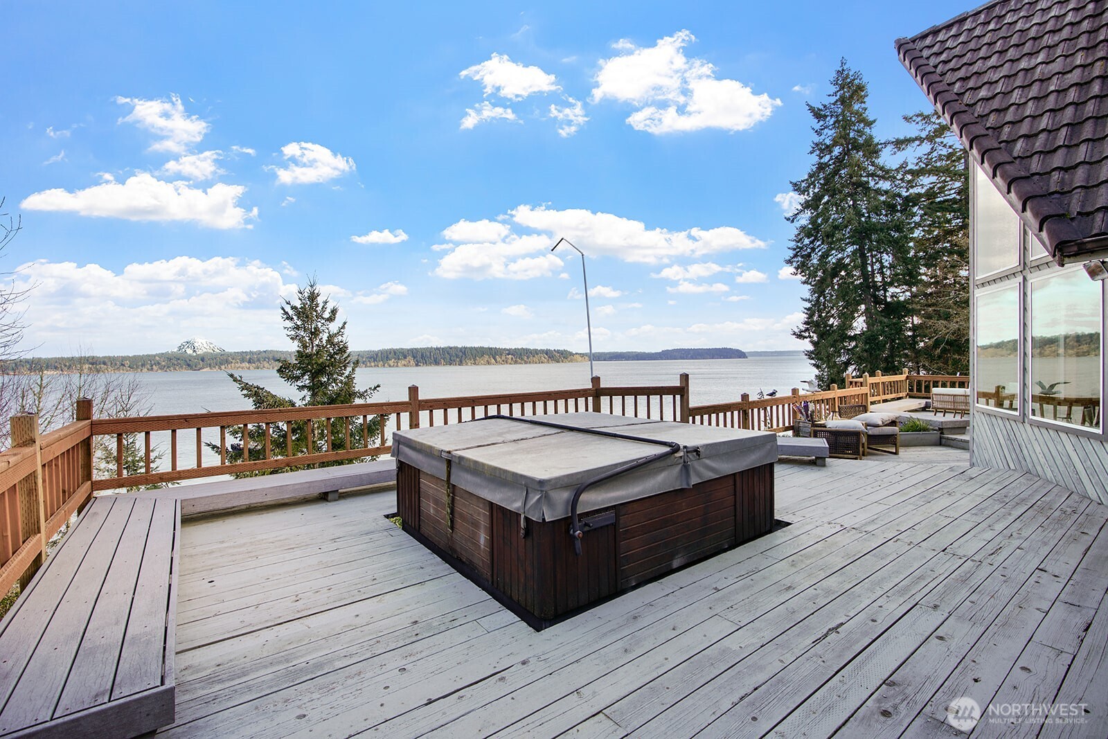 6819 Clf Avenue Southwest Longbranch, WA 98351 - Photo 20 of 29 a view of a roof deck with couches and wooden floor