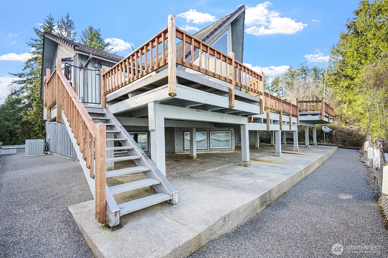 6819 Clf Avenue Southwest Longbranch, WA 98351 - Photo 21 of 29 a view of a house with a deck