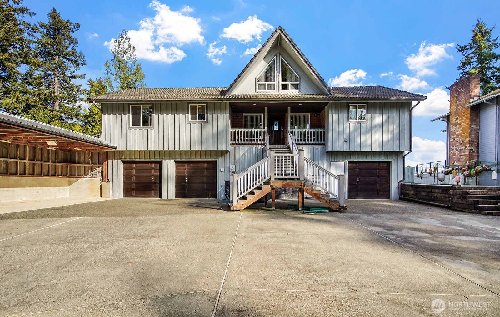 6819 Clf Avenue Southwest Longbranch, WA 98351 - Photo 22 of 29 a view of a house with sitting area and swimming pool