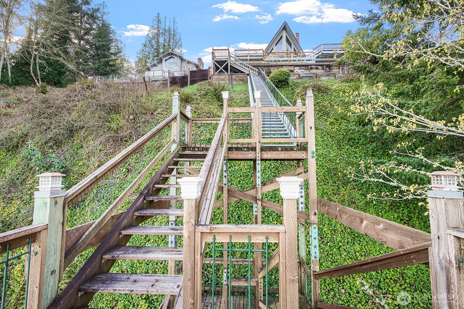 6819 Clf Avenue Southwest Longbranch, WA 98351 - Photo 28 of 29 a view of a yard with plants and wooden fence