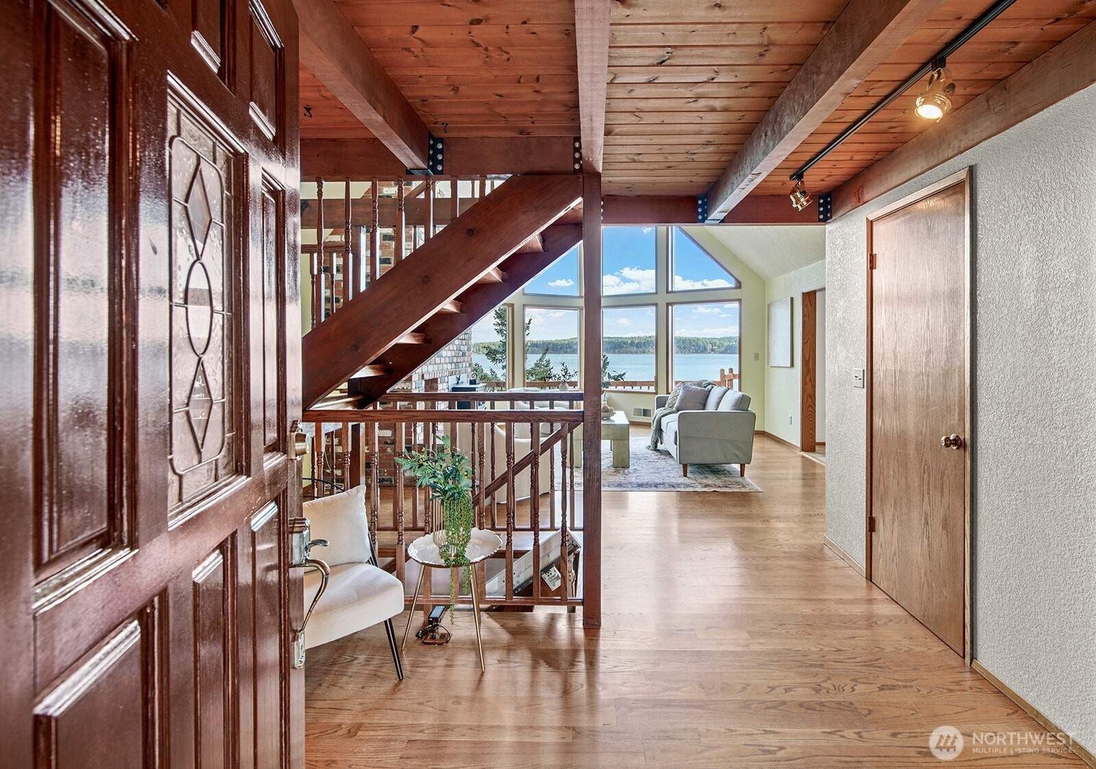 6819 Clf Avenue Southwest Longbranch, WA 98351 - Photo 6 of 29 a view of entryway and hall with wooden floor