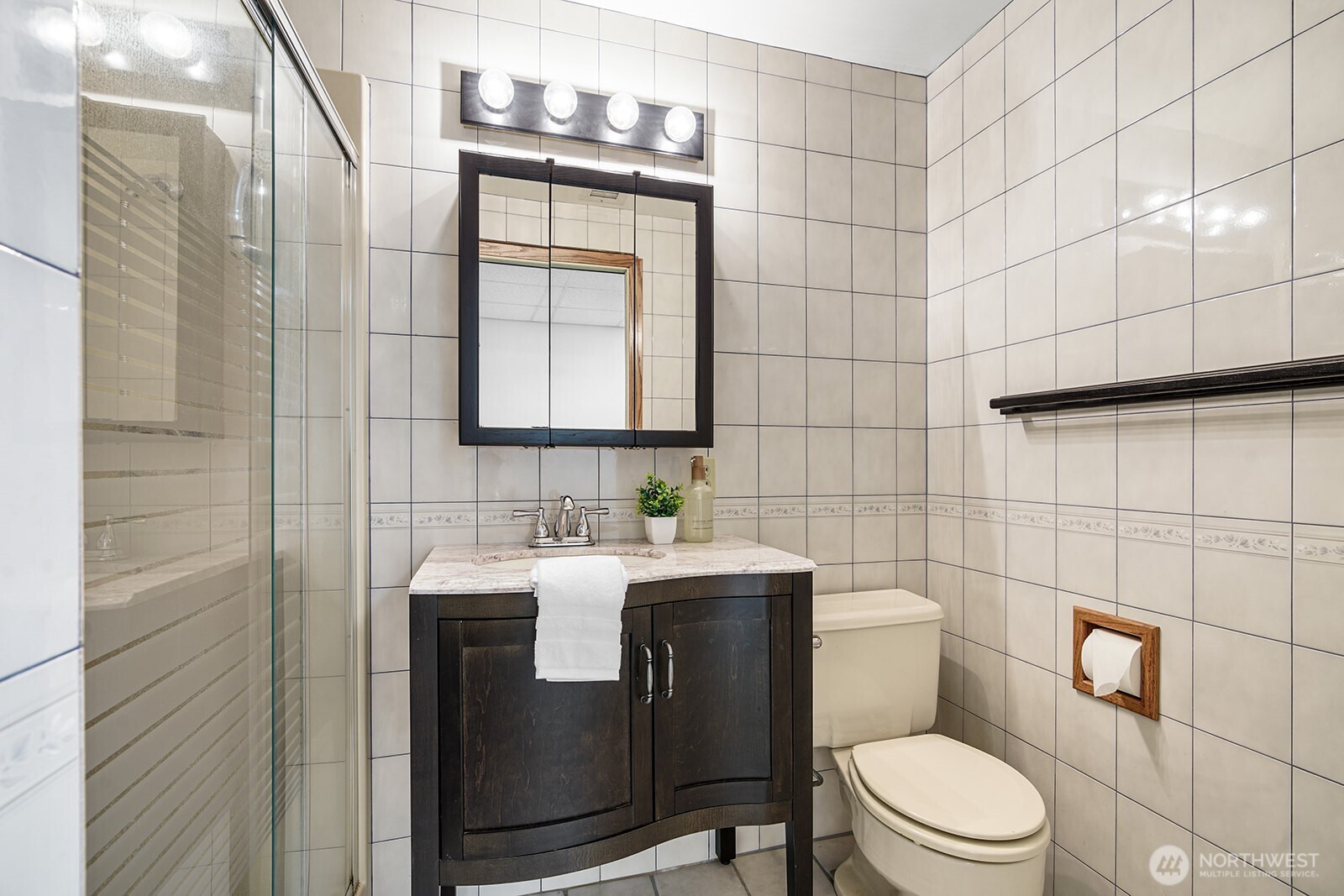 6819 Clf Avenue Southwest Longbranch, WA 98351 - Photo 9 of 29 a bathroom with a toilet sink shower and mirror