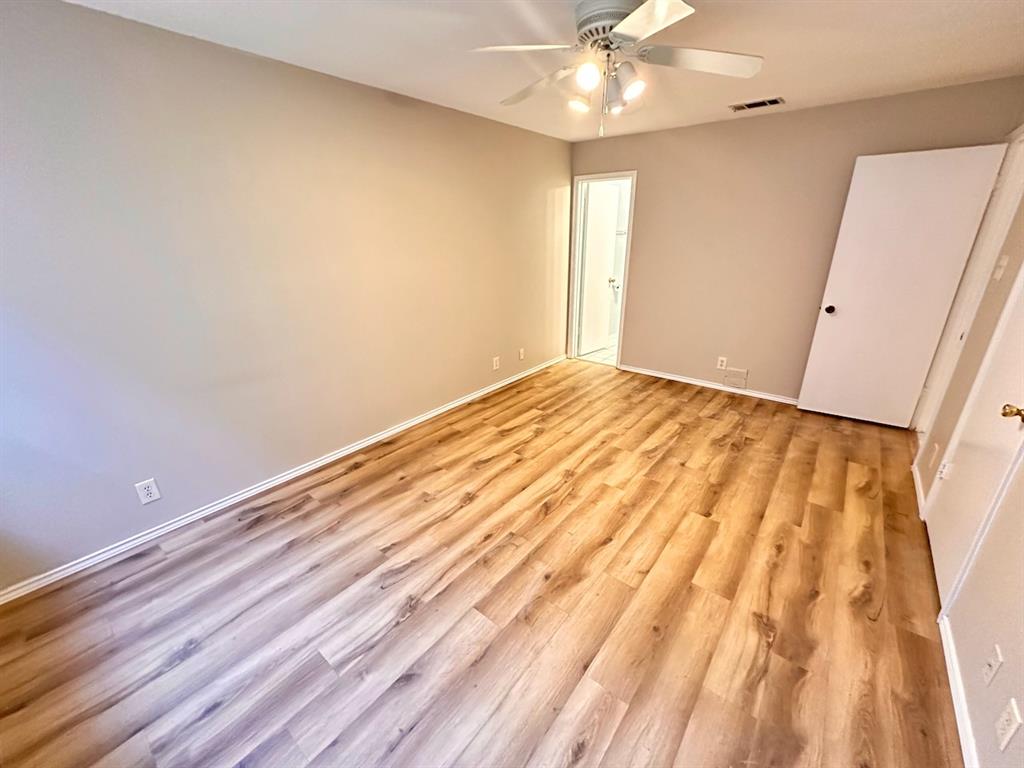 2215 Post Road, Unit 1010 Austin, TX 78704 - Photo 11 of 25 a view of empty room with wooden floor and fan